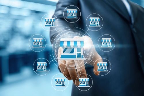 businessman hand clicks on franchise marketing